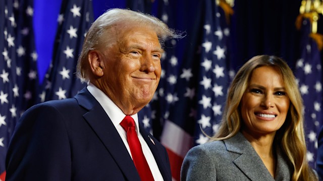 Republican presidential nominee, former U.S. President Donald Trump and former first lady Melania Trump look on during an election night event at the Palm Beach Convention Center on November 06, 2024 in West Palm Beach, Florida. Americans cast their ballots today in the presidential race between Republican nominee former President Donald Trump and Vice President Kamala Harris, as well as multiple state elections that will determine the balance of power in Congress