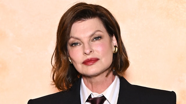 Linda Evangelista posed in black blazer and tie