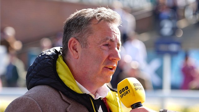 John Hunt speaking into a BBC sport microphone