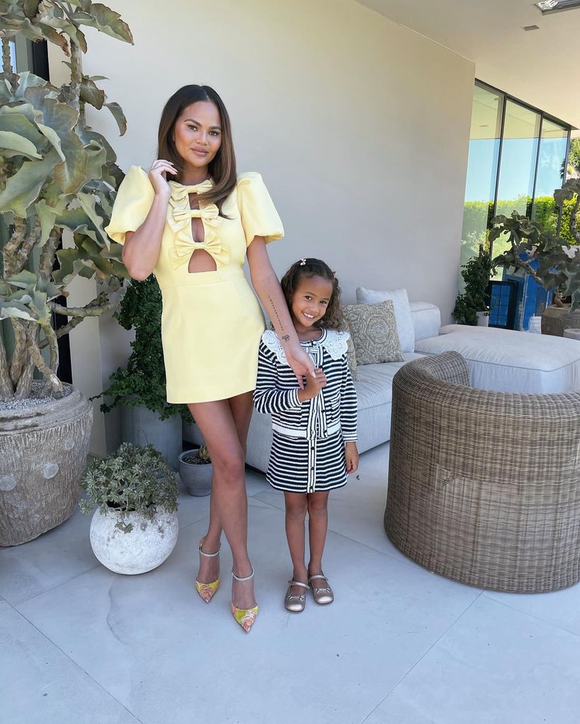 Chrissy on patio with daughter