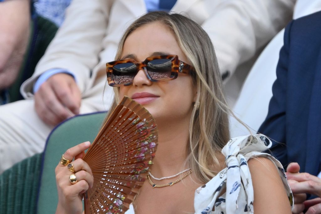 The socialite wore a butterfly-print dress