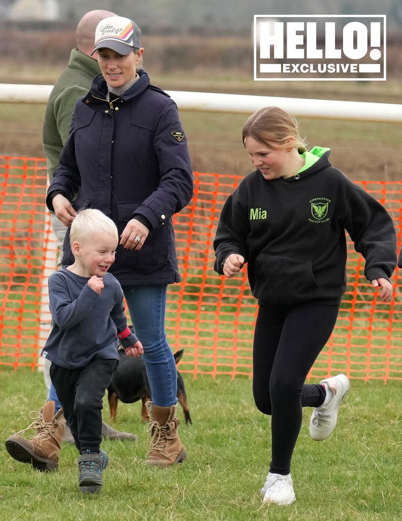 Zara Tindall plays with Lucas and her daughter Mia, embodying a country chic in skinny jeans and a wax jacket