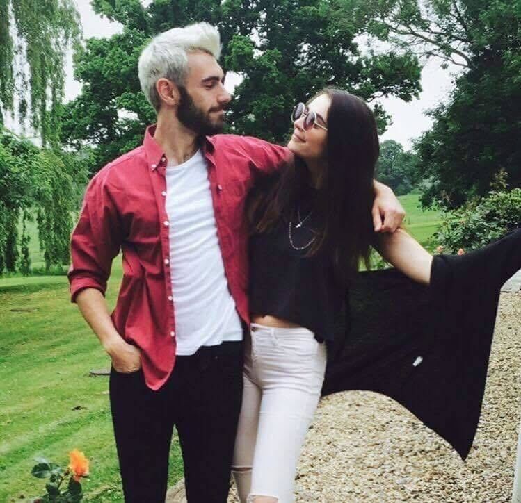 Me (with my cooler older brother Charlie) in my prized low-rise pink Topshop jeans, Topshop Freedom necklaces and Brandy Melville cardigan 