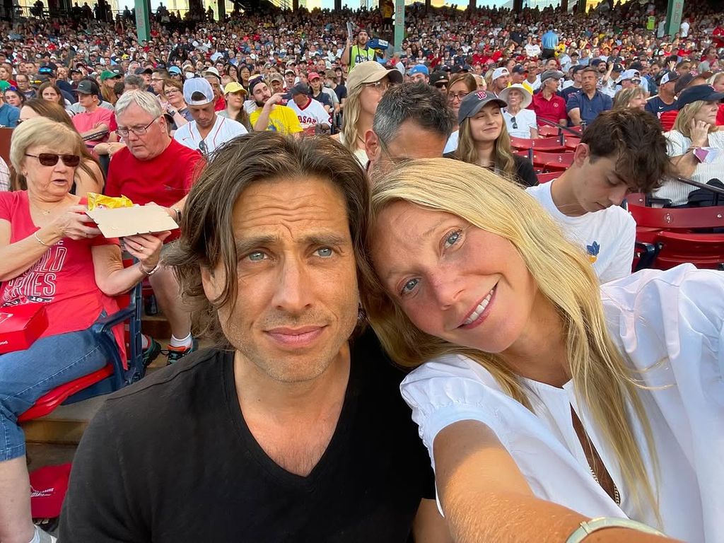 Gwyneth Paltrow and her husband Brad Falchuk pose for a selfie at a game, shared on Instagram