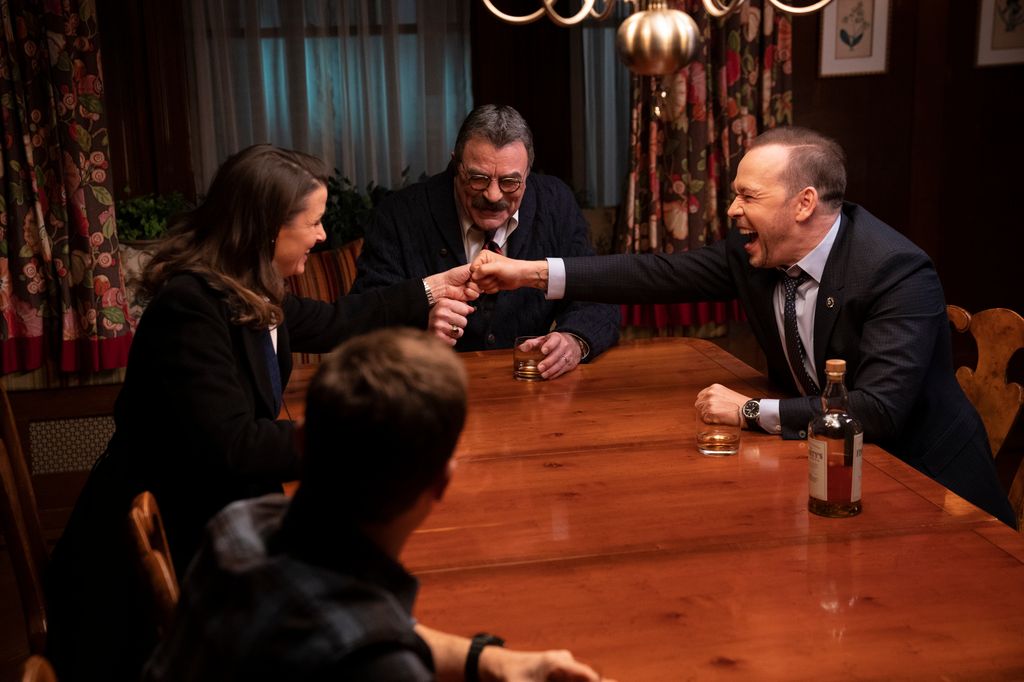 Bridget Moynahan as Erin Reagan, Tom Selleck as Frank Reagan, Donnie Wahlberg as Danny Reagan on Blue Bloods.