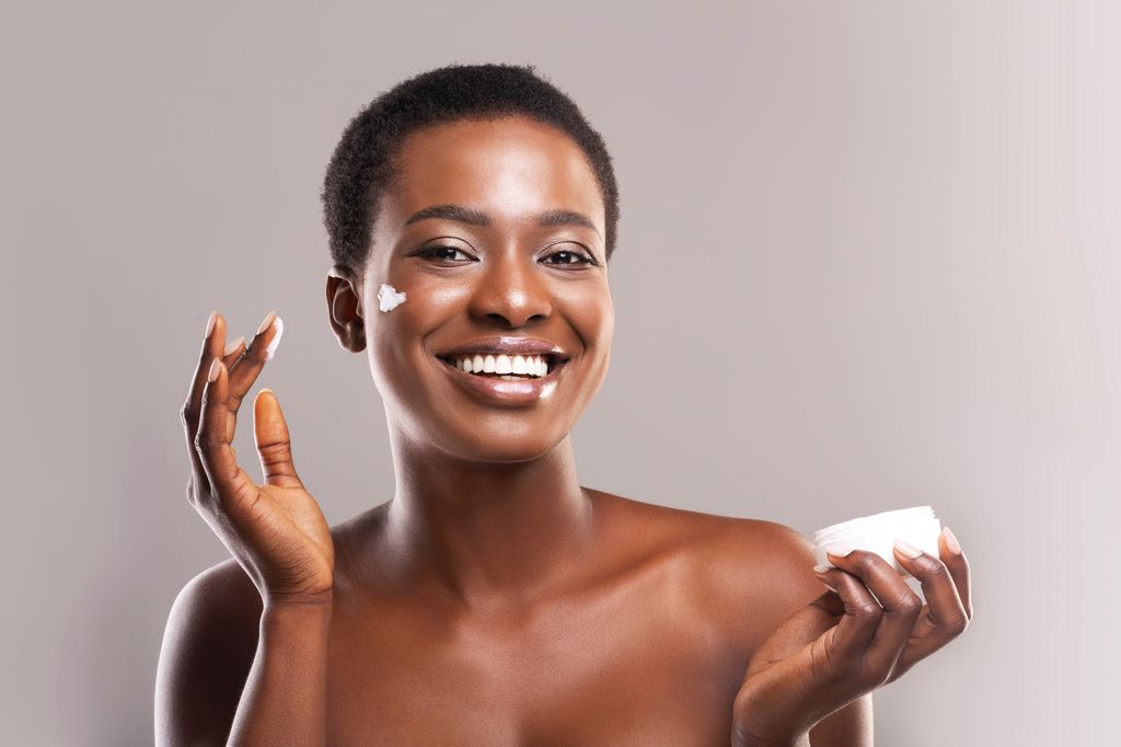 Woman with heart shape on her cheek