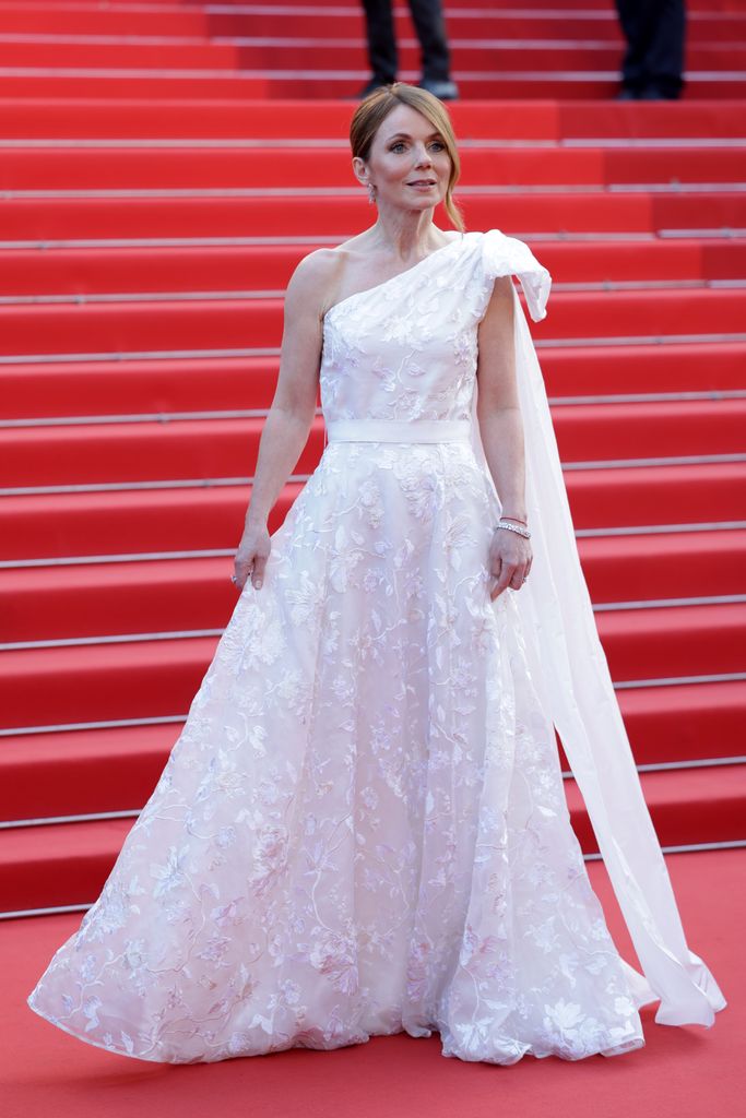 Geri's Horner wore a white dress adorned with embroidered lace and a sweeping tulle train
