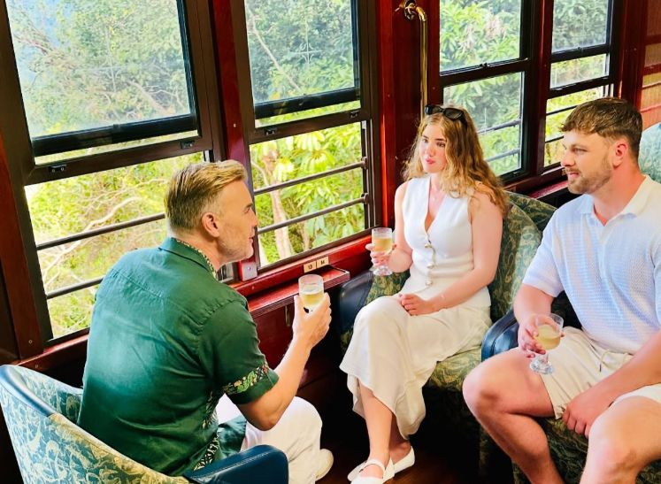 Gary Barlow, his daughter Emily and her boyfriend, Marshal, drinking wine