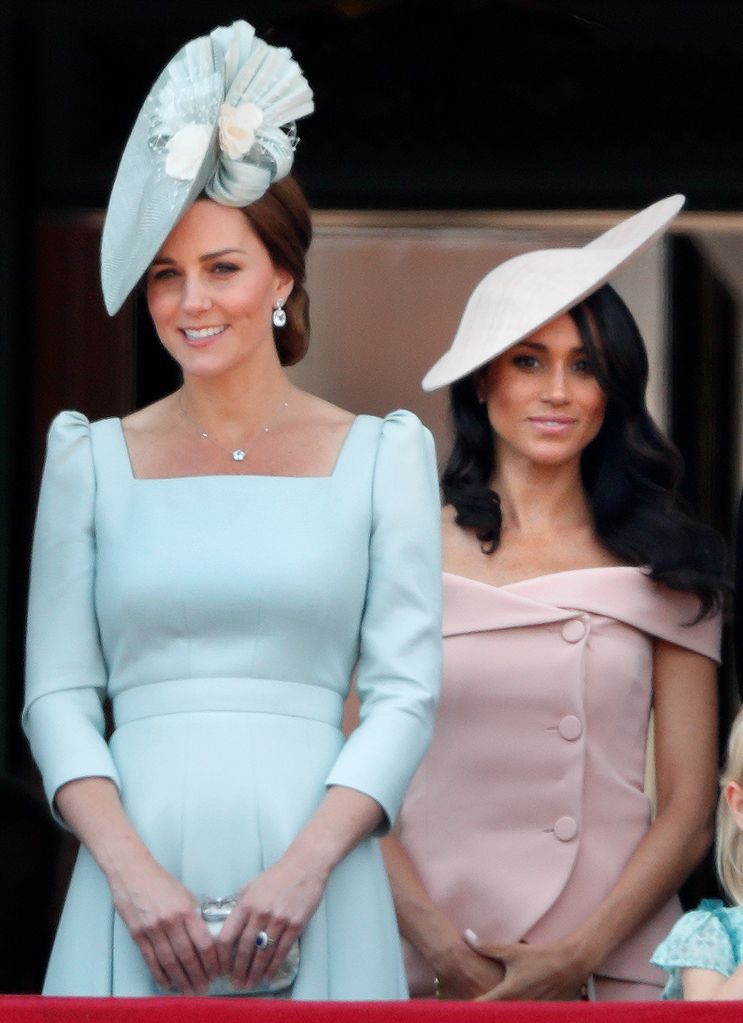 Catherine, Duchess of Cambridge and Meghan, Duchess of Sussex stand on the balcony of Buckingham Palace during Trooping The Colour 2018 on June 9, 2018 in London, England. 