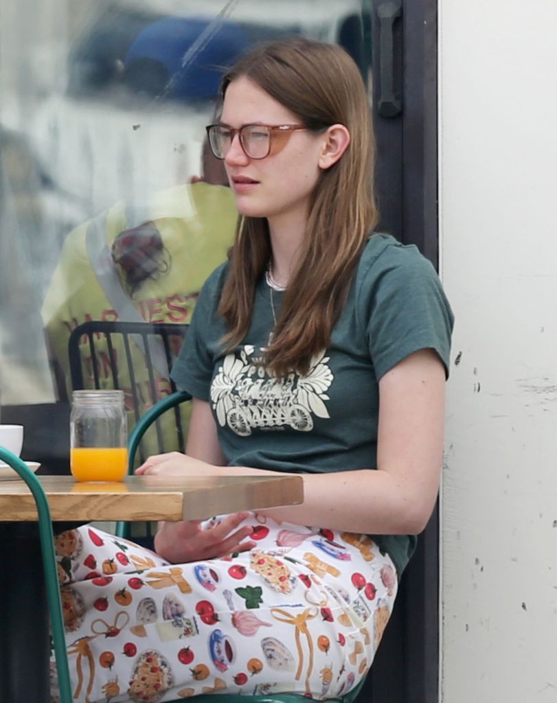 Violet has lunch wears bold pants with food on them