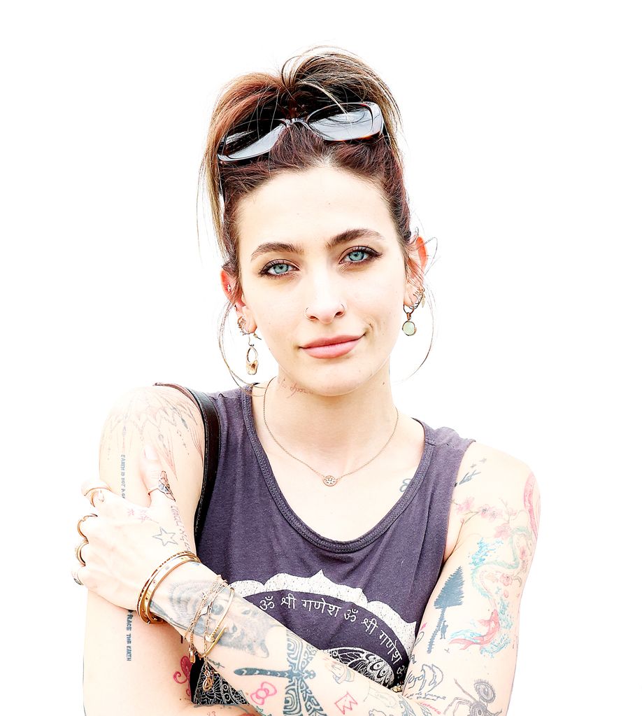 Paris Jackson smiling against a bright white background