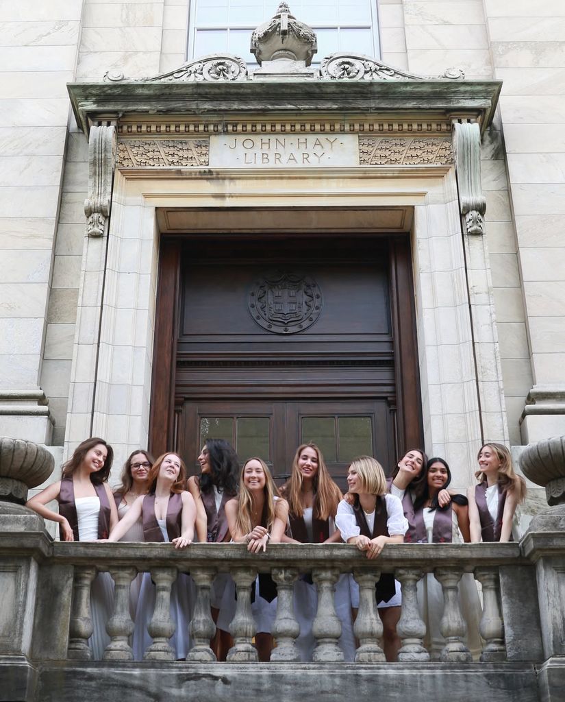 Photo shared by Brown University featuring Catherine Zeta-Jones and Michael Douglas' daughter Carys to the left, ahead of her May 25, 2026 graduation