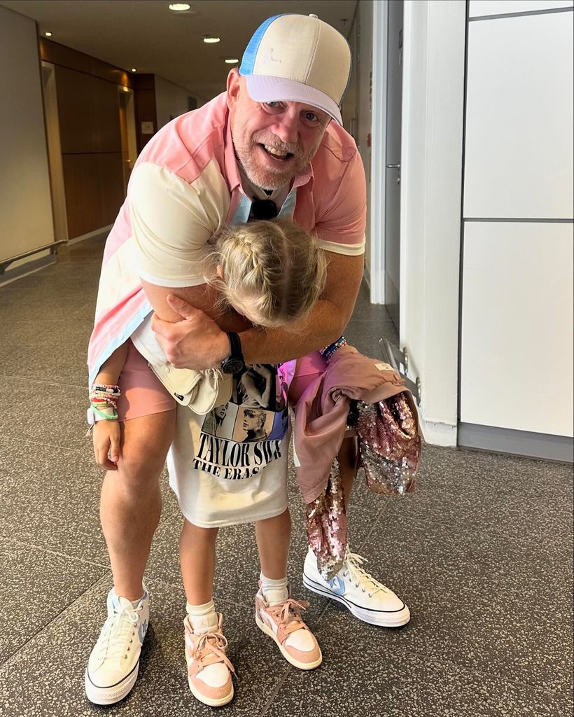 MIke cuddling his daughter Lena