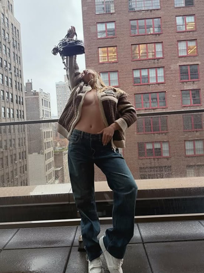 Sydney sweeney in knit and jeans