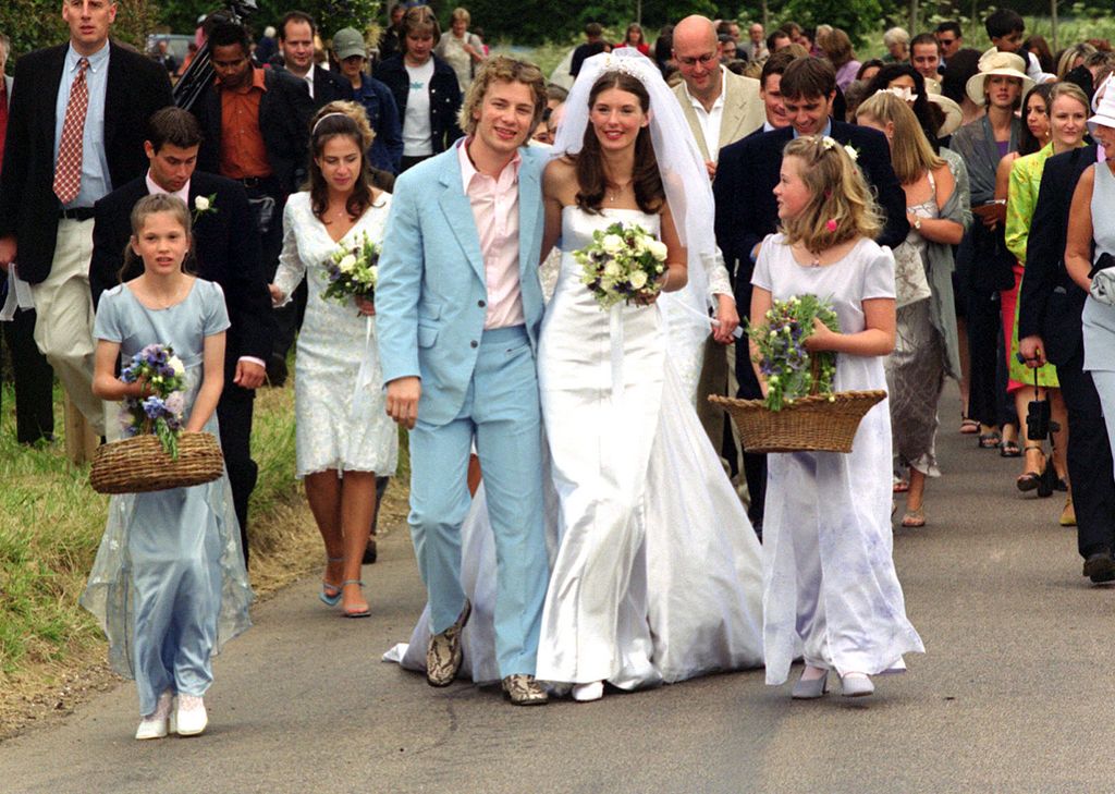 Celebrity television chef Jamie Oliver (wearing a blue Paul Smith suit) and his bride Juliette Norton (Jools) after their wedding ceremony at All Saints Church , Rickling, in Essex.