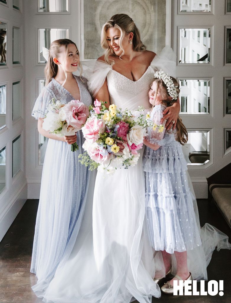 Louise Pentland hugging her daughters on  her wedding day