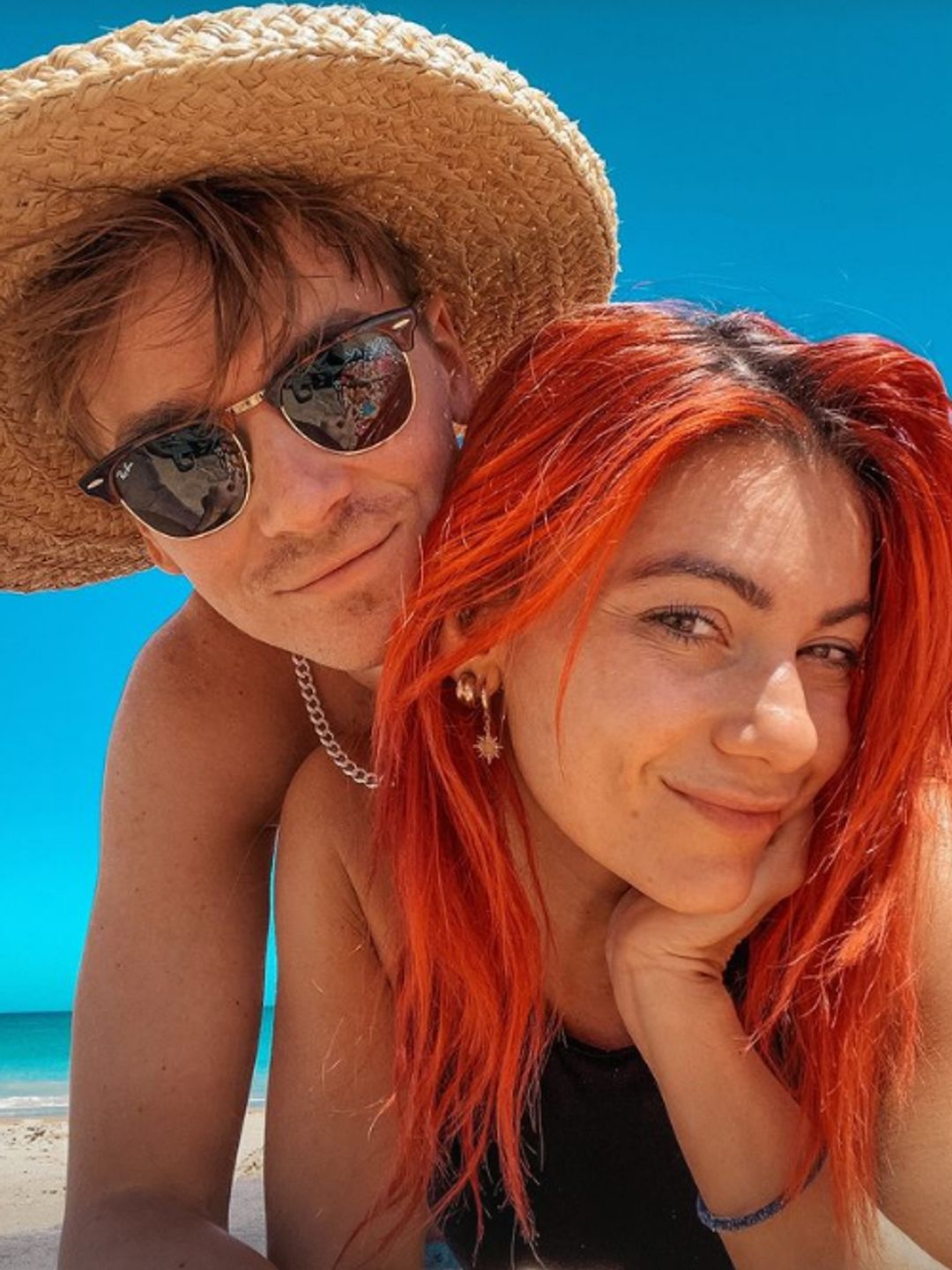 Joe Sugg lying on top of Dianne Buswell