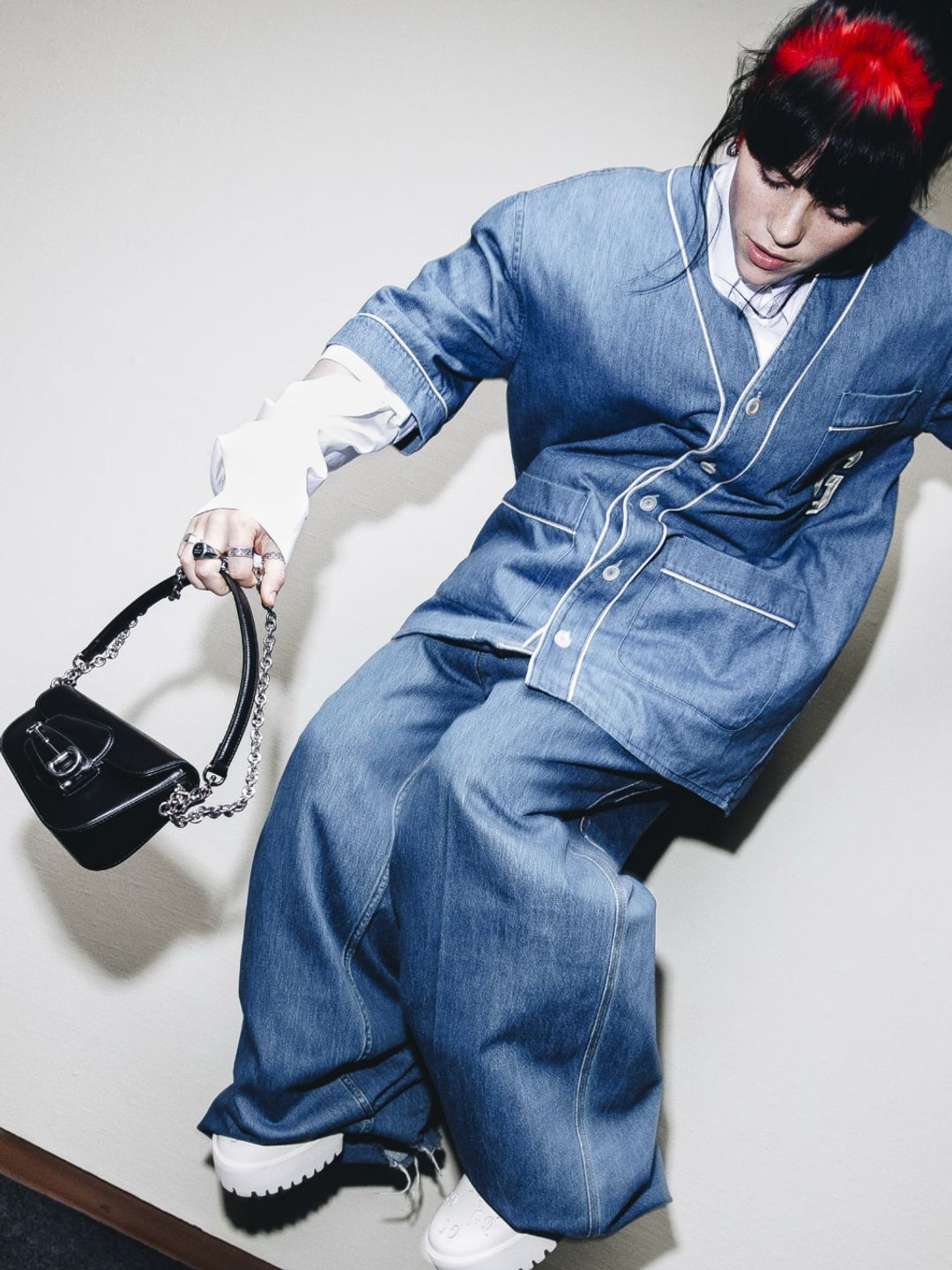 Billie Eilish wear a double denim outfit whilst posing for Gucci's newest campaign