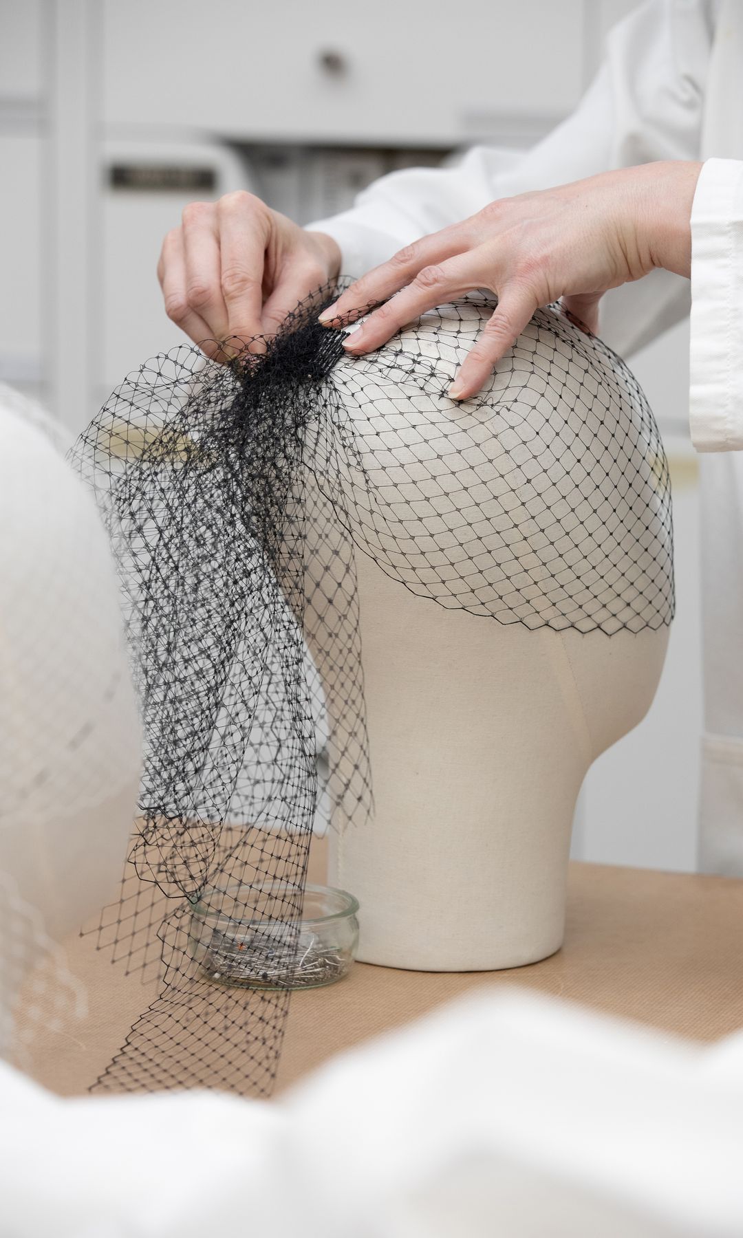 miranda kerrs netted headpiece for the met gala being made