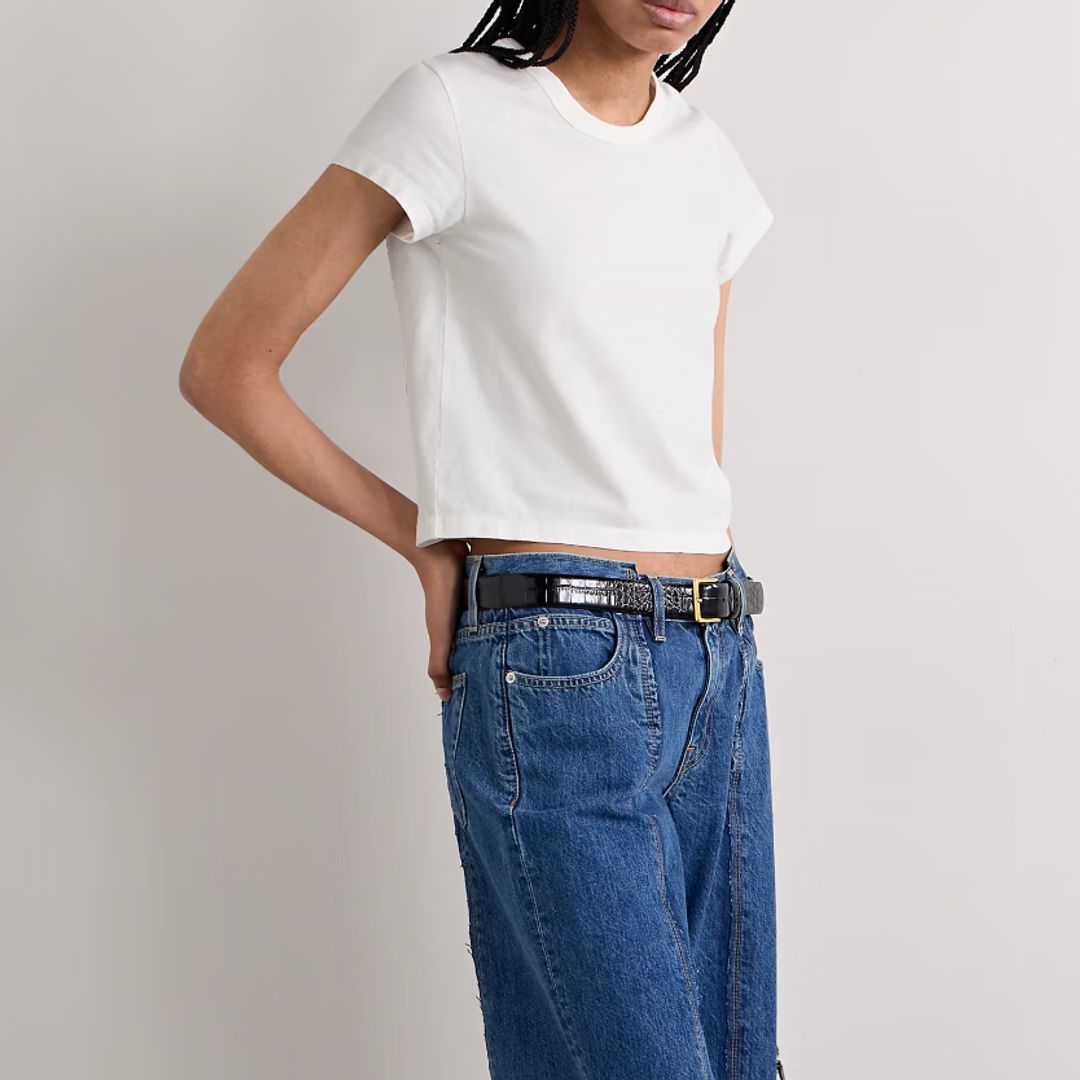 An e-commerce model poses in the SLVRLAKE Easy cotton-jersey T-shirt and blue jeans