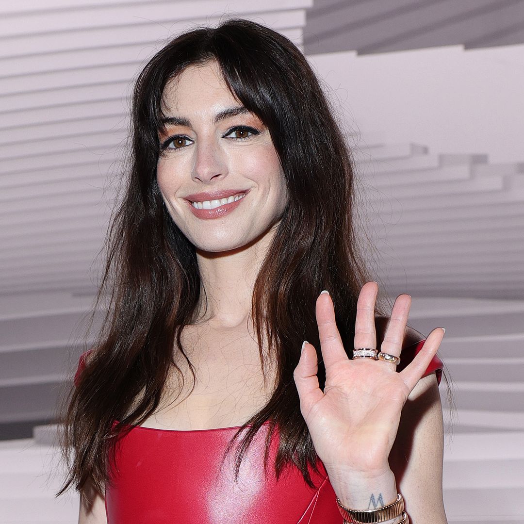 Anne Hathaway's jaw-dropping red leather dress is a fashion triumph for SS25