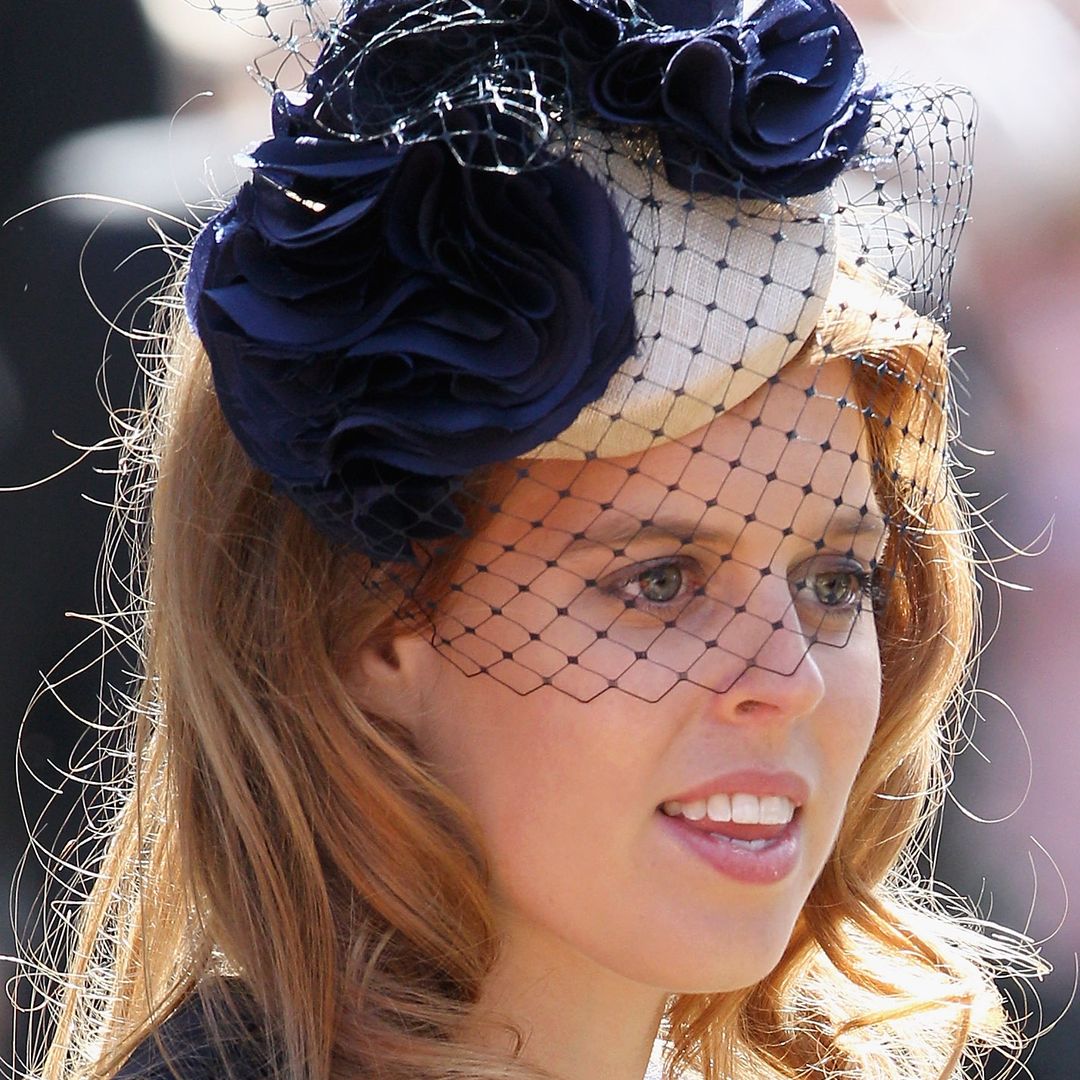 Princess Beatrice's silky red hair looks so long as she expertly styles a blazer