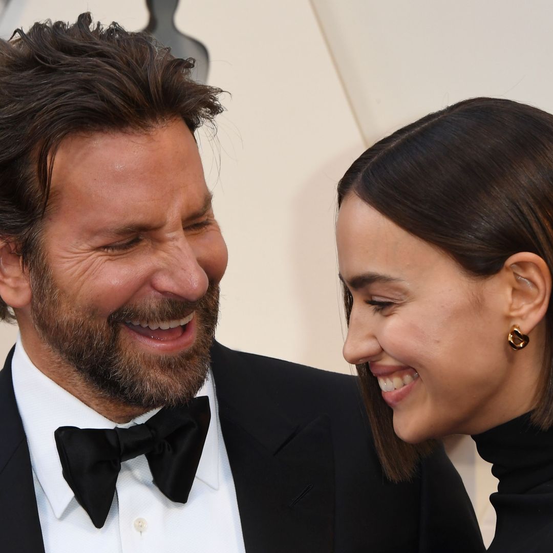 Irina Shayk poses topless with Bradley Cooper as she hints at 'rocky' summer amid Tom Brady romance